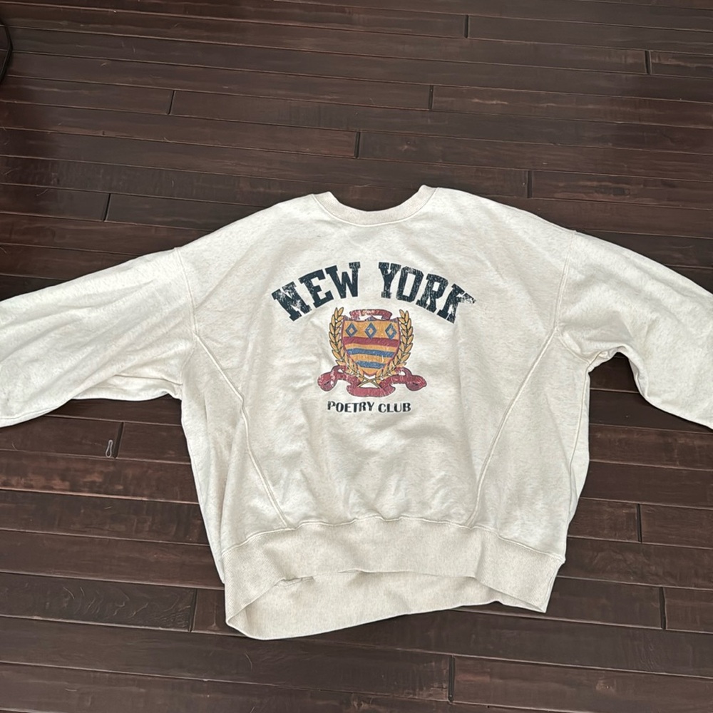 An oversized crewneck, lightly worn